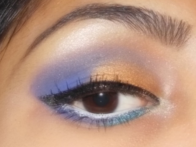 Gold and Purple Eye Makeup with White Waterline
